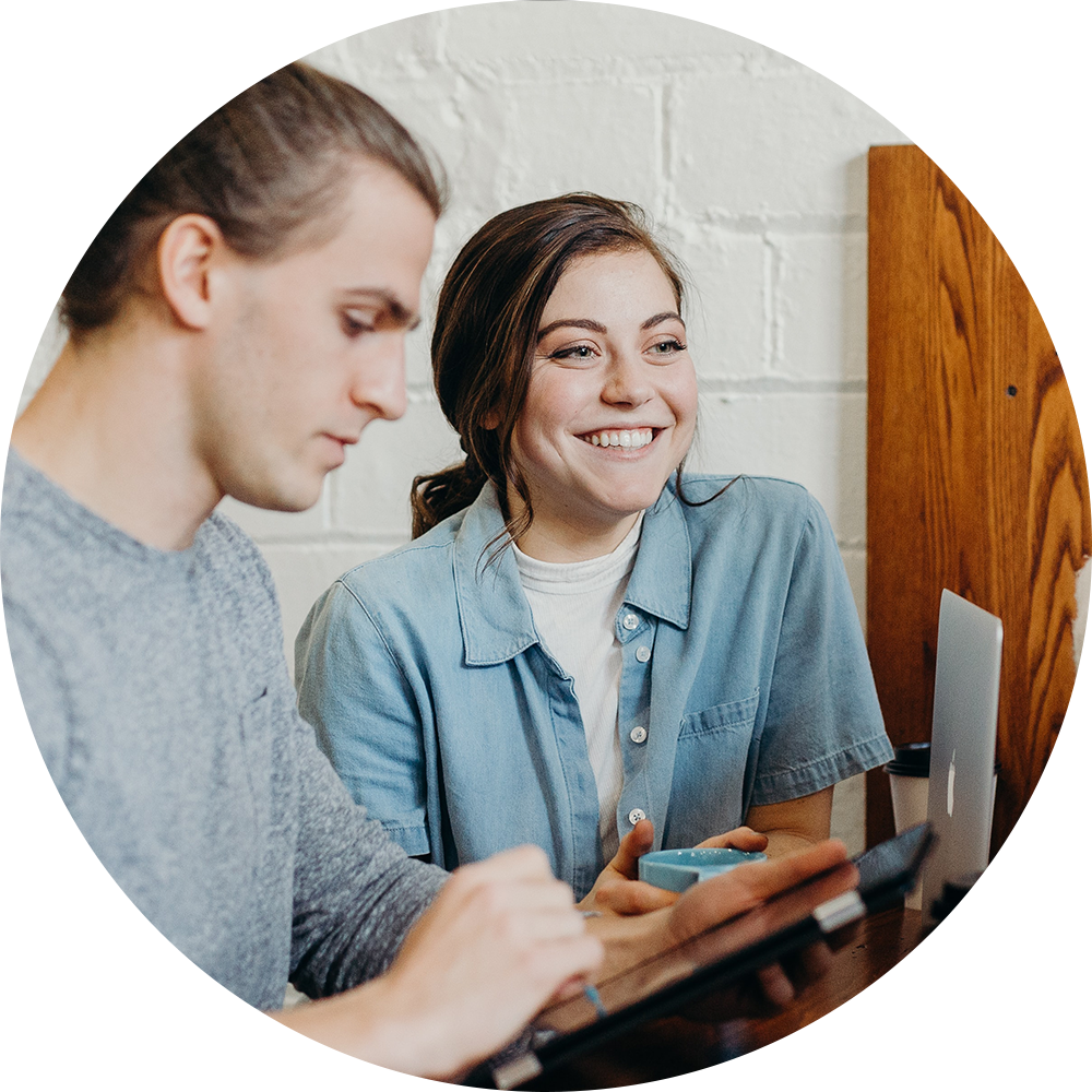 Young adults converse at a coffee shop